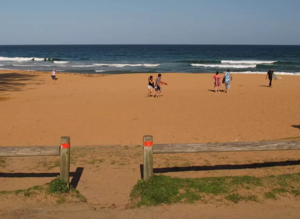 People enjoying a warm October day at the beach.