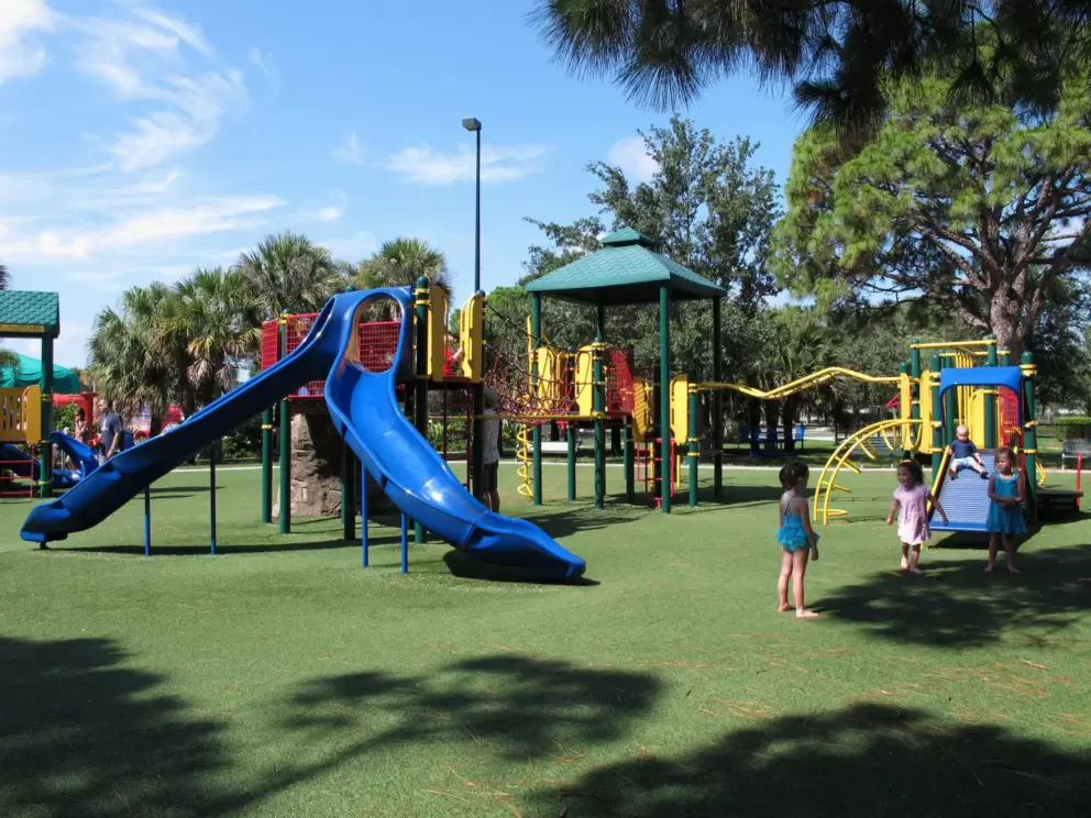A group of girls enjoy the playground on a sunny June day.