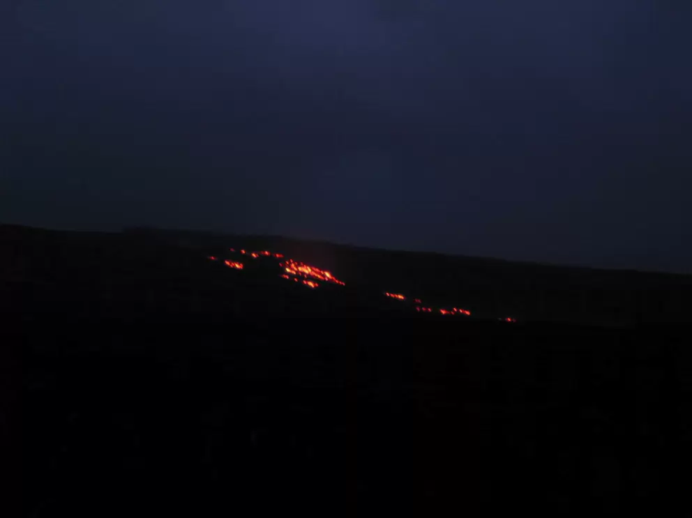 Red lava flowing down the mountain above where we stood.