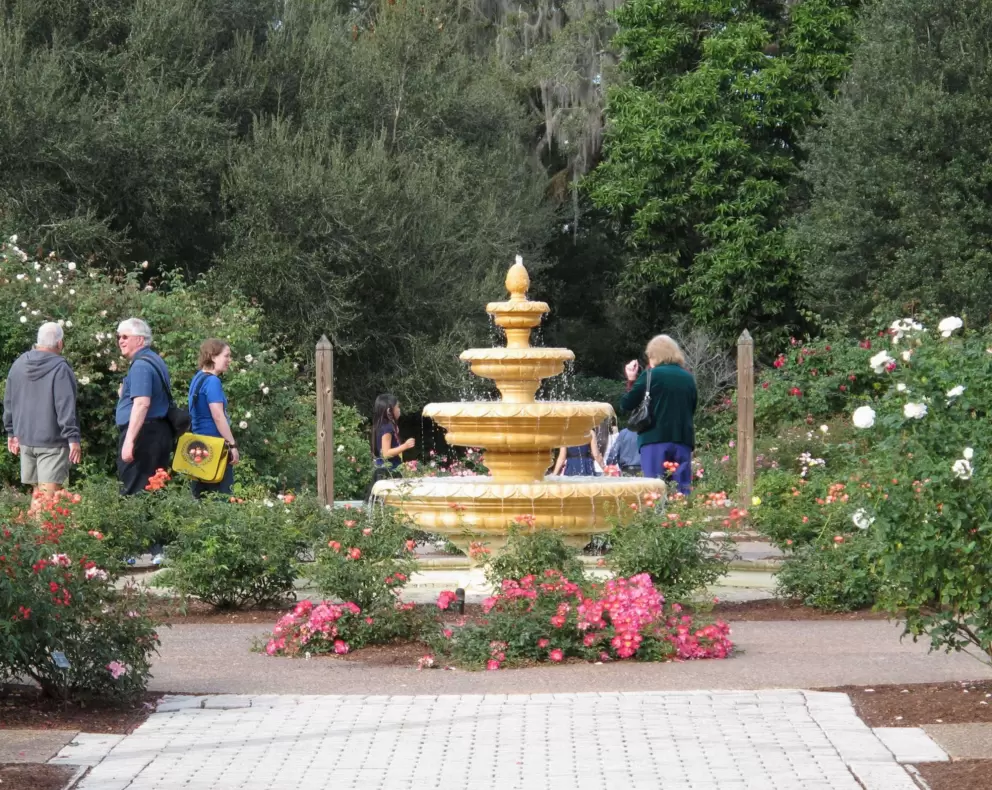 Visitors enjoy the rose garden with its Spanish fountain.