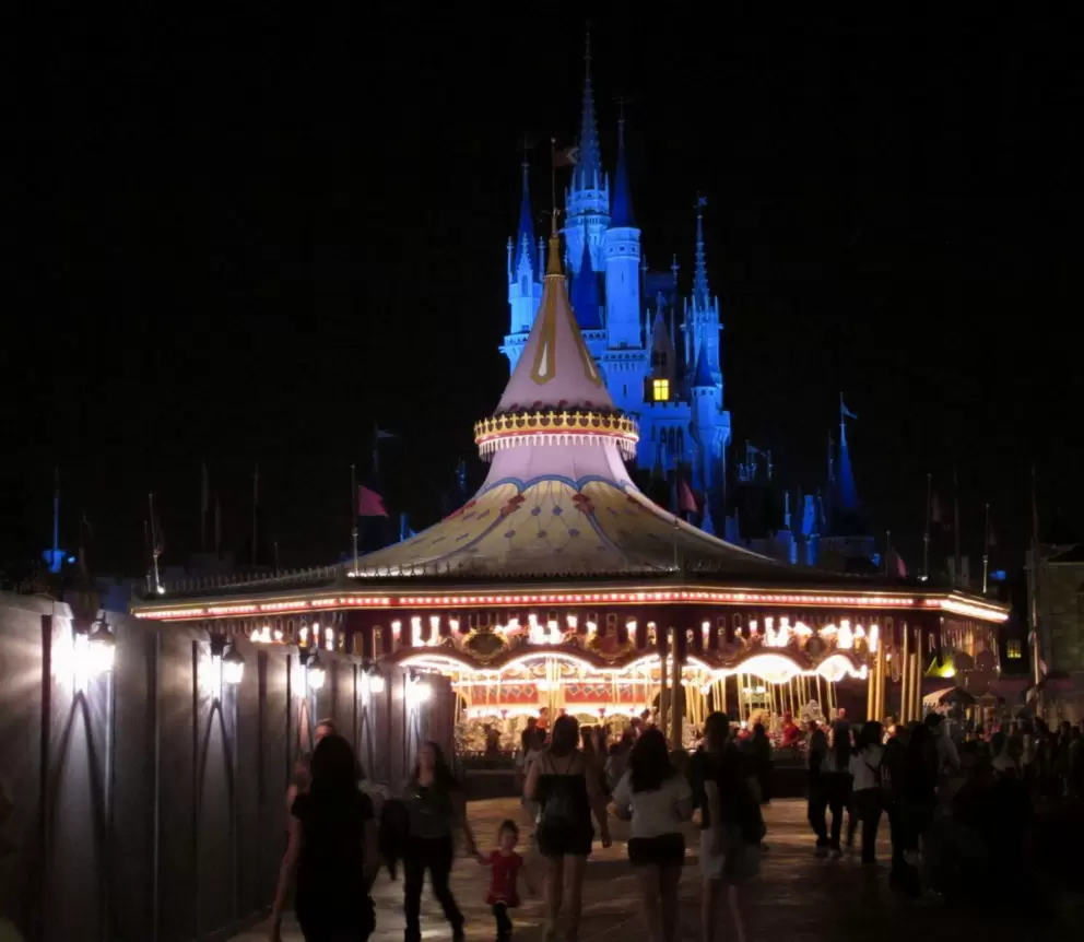 Carousel and blue-lit castle behind.