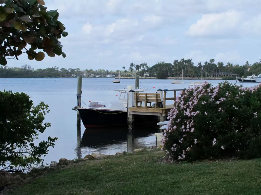 Boat docked on the intracoastal waterway- one of the peaceful scenes along this secret walkway.