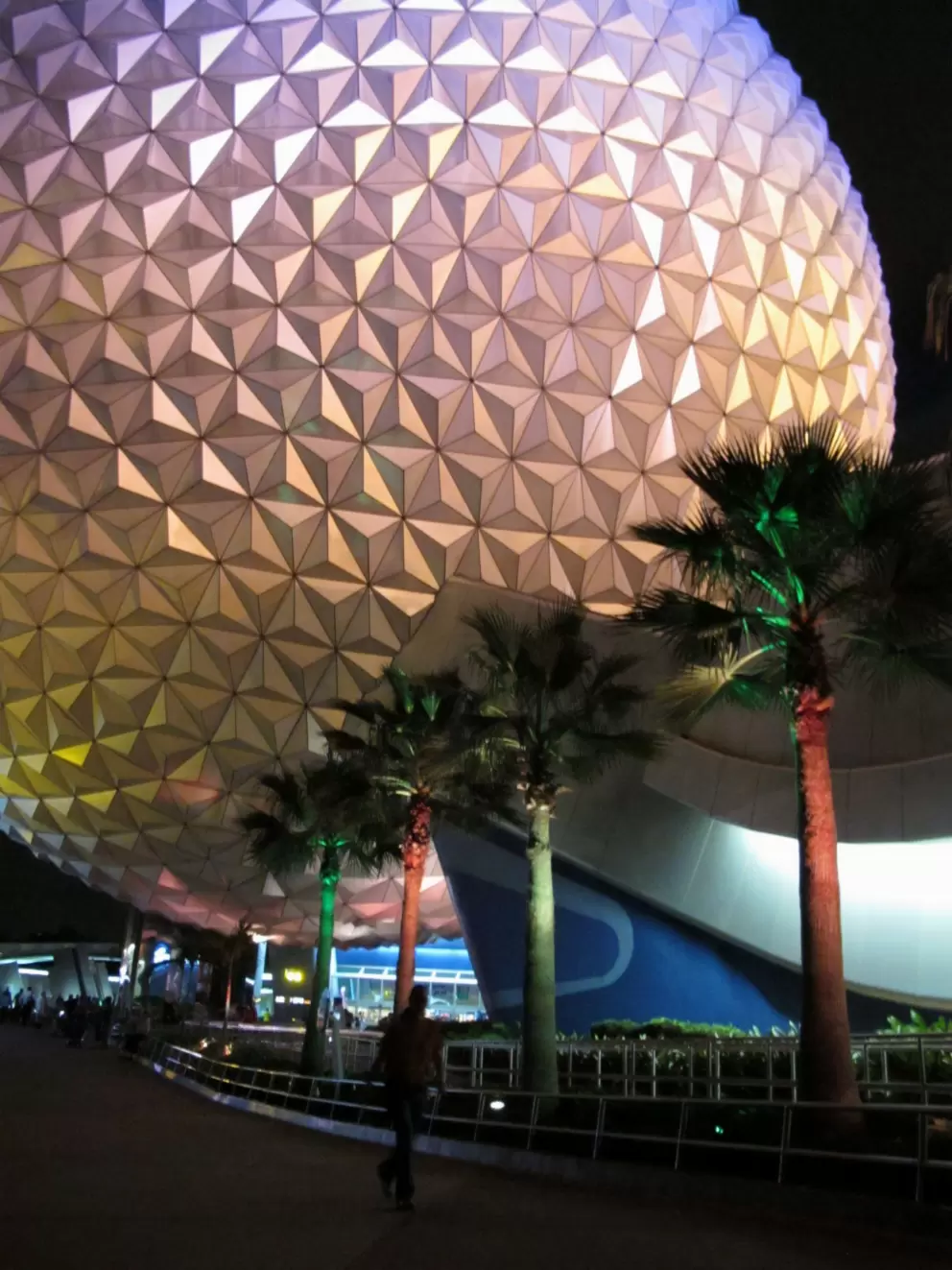 The Spaceship Earth geosphere lit at night.