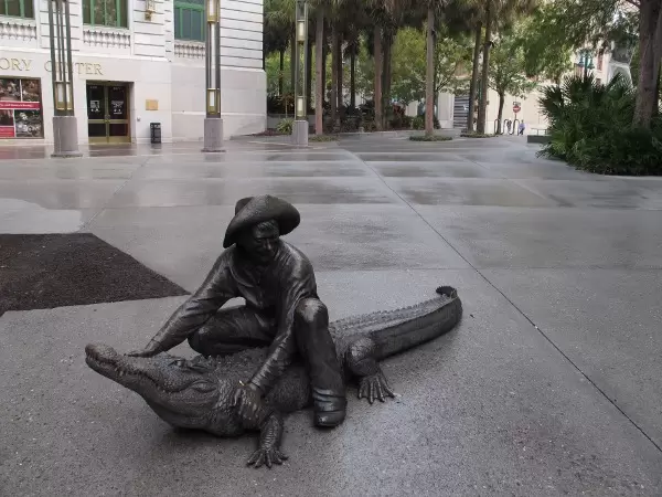 Alligator wrangler sculpture in Heritage Square.