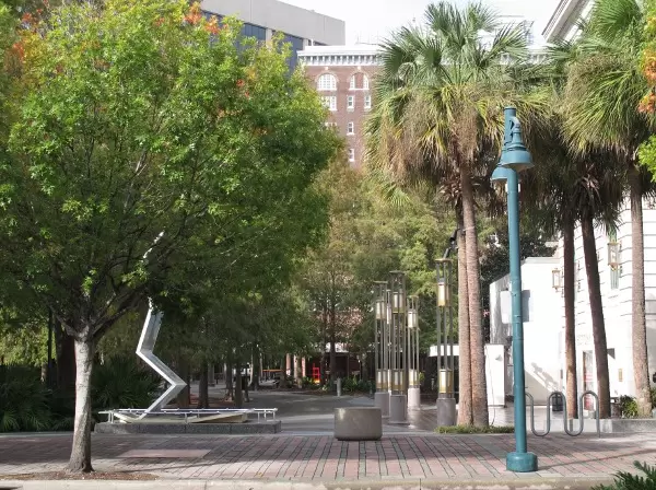Trees, public art, and historical buildings at Heritage Square.