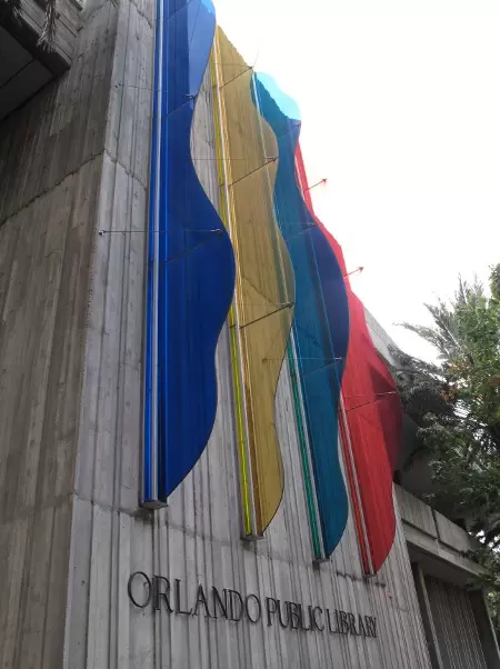 Rainbow-colored decorations on the side of the public library.