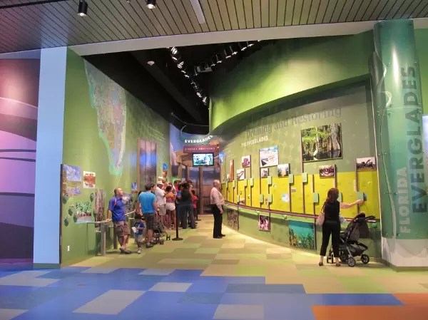 People wait for the airboat ride at the Everglades exhibit area.