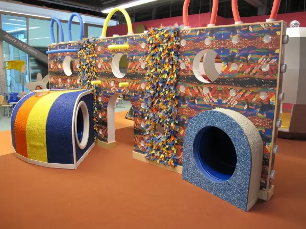 Kids can climb inside this colorful tunnel in the Wonderscapes area!