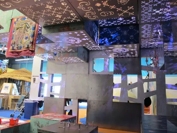 Colored lights shine through stencil designs in the Vodou section, the most magical section of all.