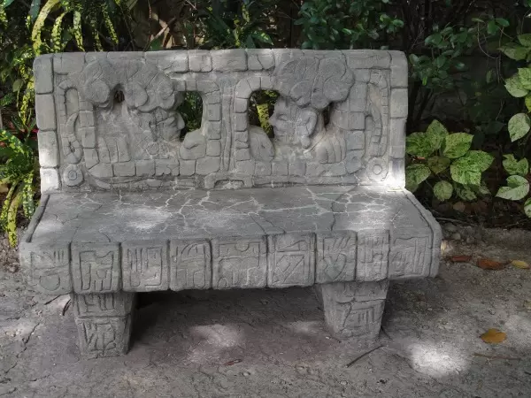 A carved stone bench in the Tropics of the Americas section.