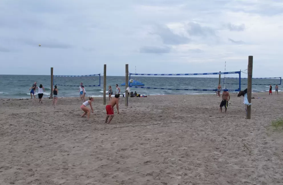 Volleyball players enjoy the southern end of the beach.