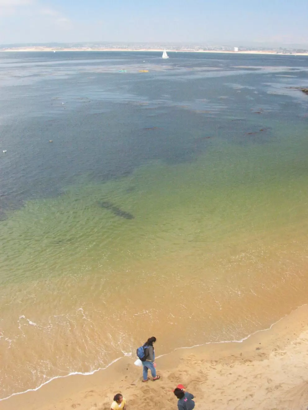 Tourists enjoy little McAbee Beach and its views of the Monterey Bay.