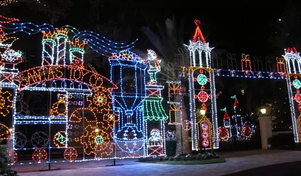 The amazing toy factory lights on a mansion's gate.
