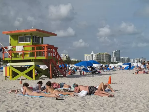You see the Miami skyline from the beach.