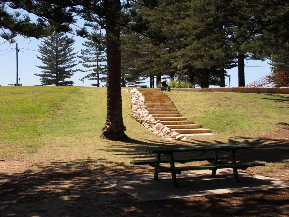 Picnic table and sandstone stairs.