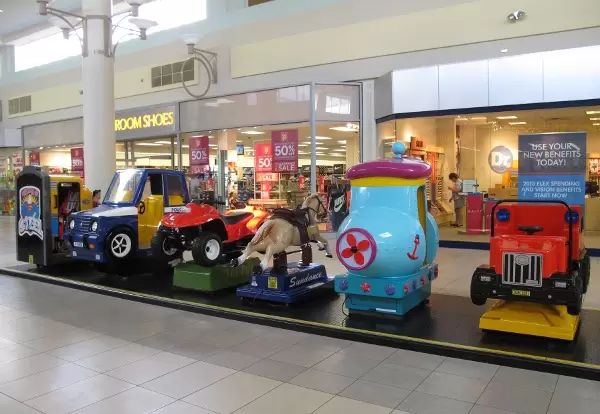 The coin-operated cars.