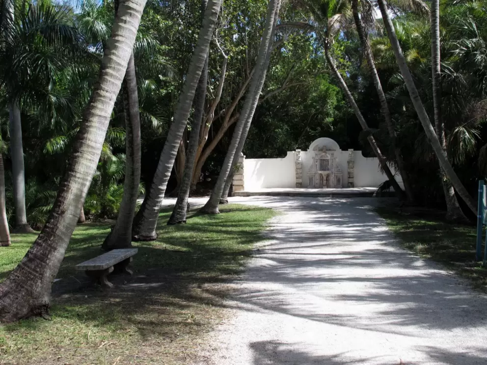 Palm-shaded path leading to fountain.