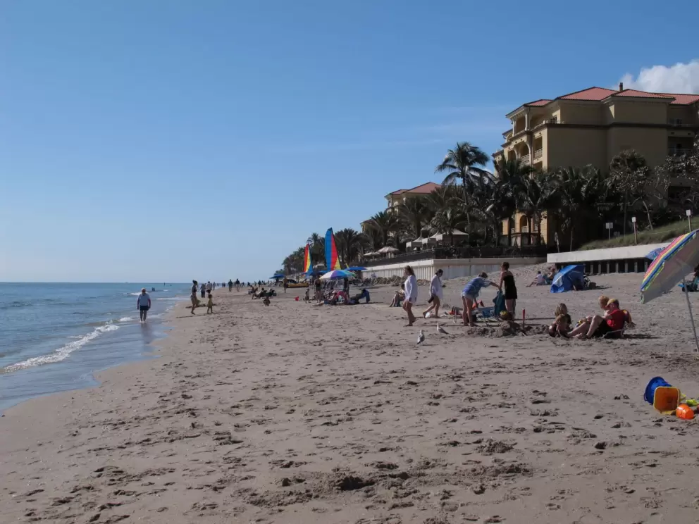 People enjoying a winter day at Lantana Beach.