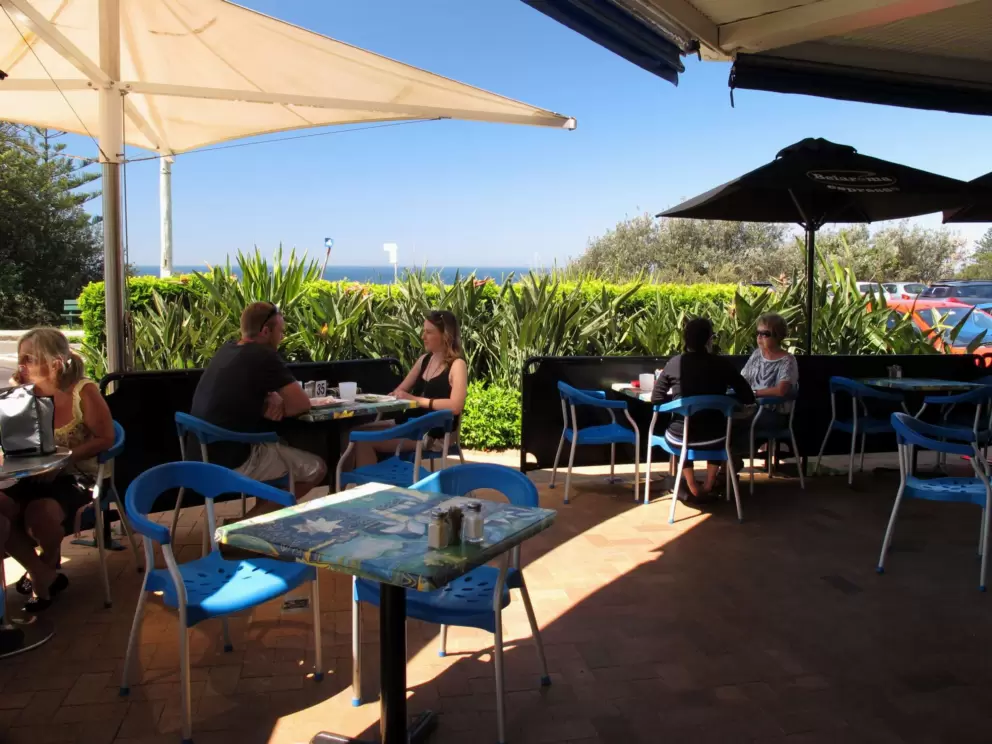Sunrise cafe patio and strip of blue sea. Bliss!