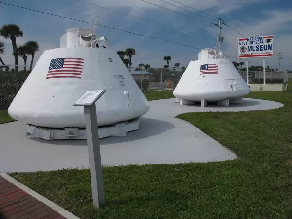 Two training Apollo Space Capsules that frogmen met upon splashdown, attached a flotation collar to, opened the hatch, then helped the astronauts board a helicopter.