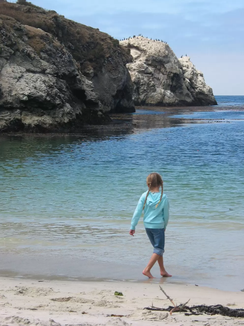 A little girl enjoying herself at the shore (you can no longer go down to the beach at China Cove).