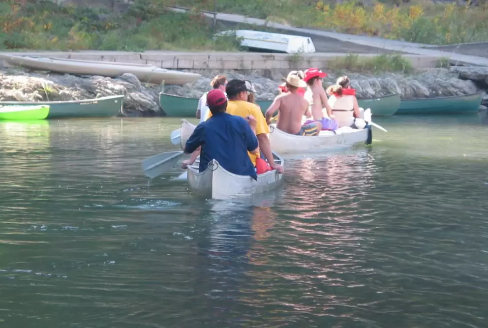 Groups of happy paddlers row down the river on weekends.
