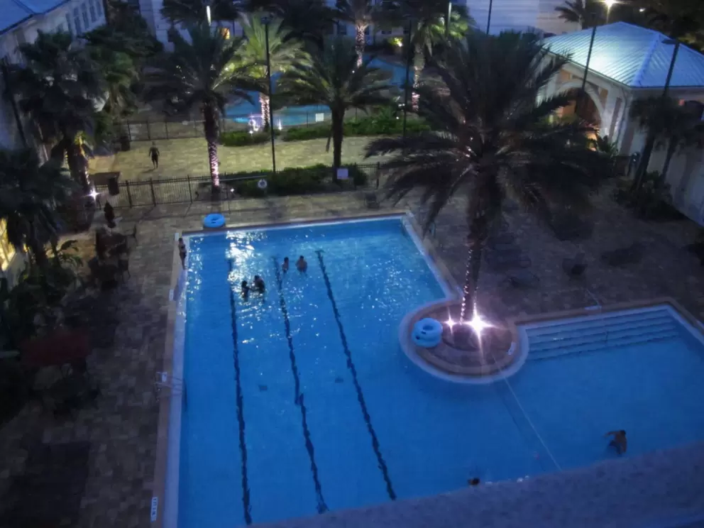 Nighttime swim at Osprey Fountains residence hall pool.