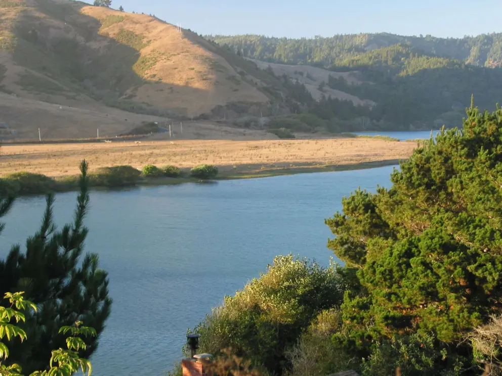Early evening at the river bend, as seen from Russian House #1 Restaurant.