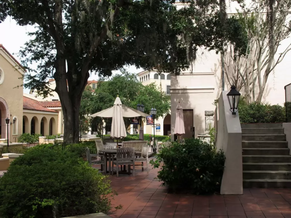 Chairs and umbrella, arches and Spanish lampposts.