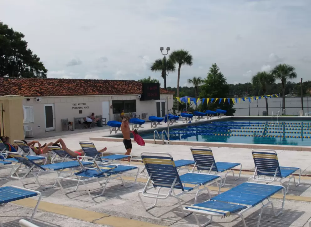 Students relaxing at the pool.