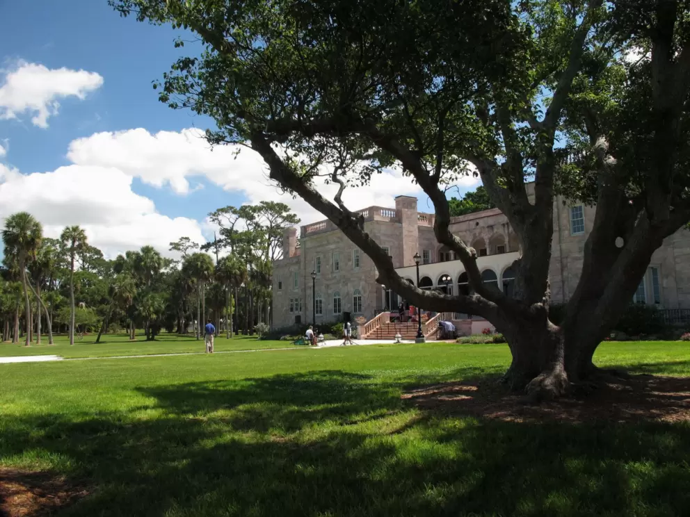 Shade on the waterfront lawn behind College Hall.