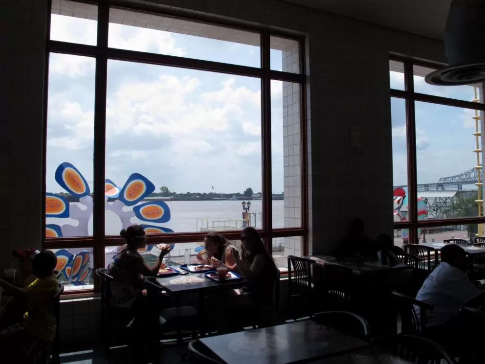 The upstairs eating area with its big windows and great view.