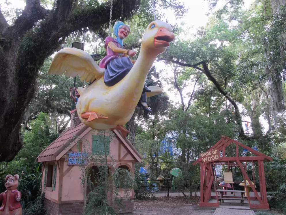 Mother Goose flying in the treetops.