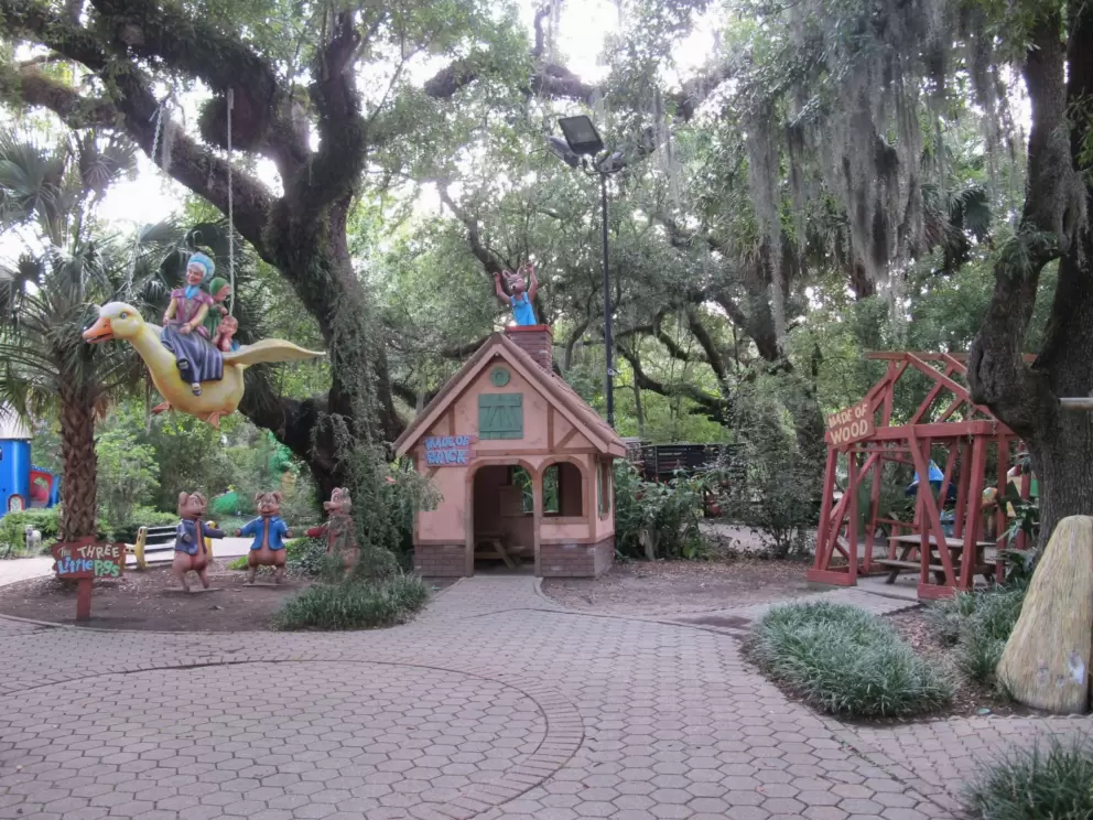The three little pigs, the house of brick, the house of wood, and Mother Goose flying- all in the beautiful forest!