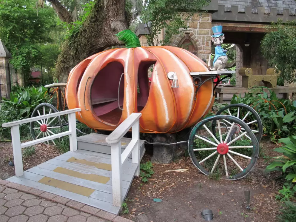 Cinderella's pumpkin carriage and the rat who is the coachman.