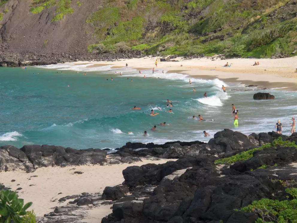 Bodyboarders in the late afternoon at Makapuu Beach.