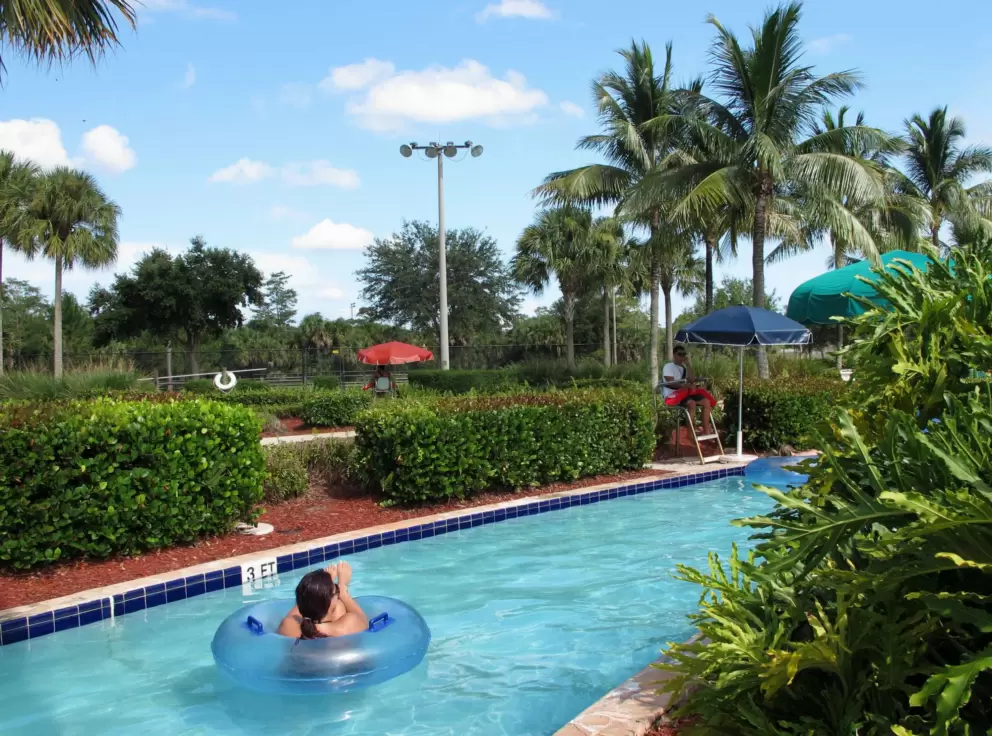 A lady relaxing in her tube on the lazy river.