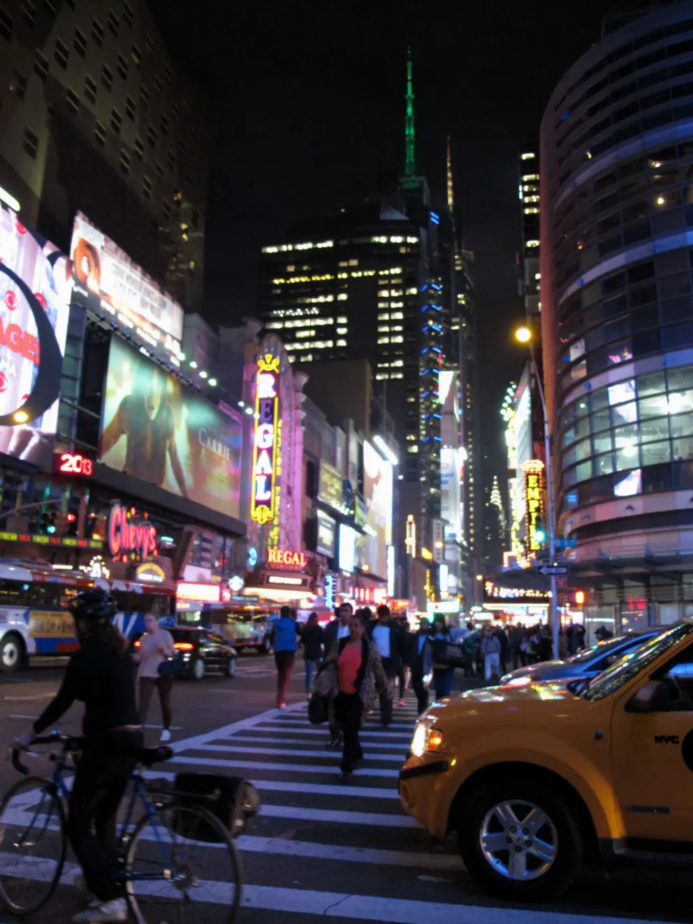 The neon lights and lit-up spires are a rainbow of colors.