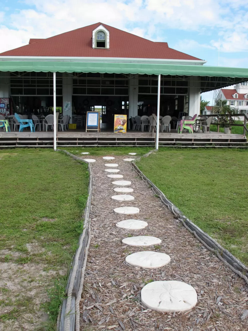 The boathouse, where you can get an ice cream popsicle. See the cute sand dollar stepping stones.