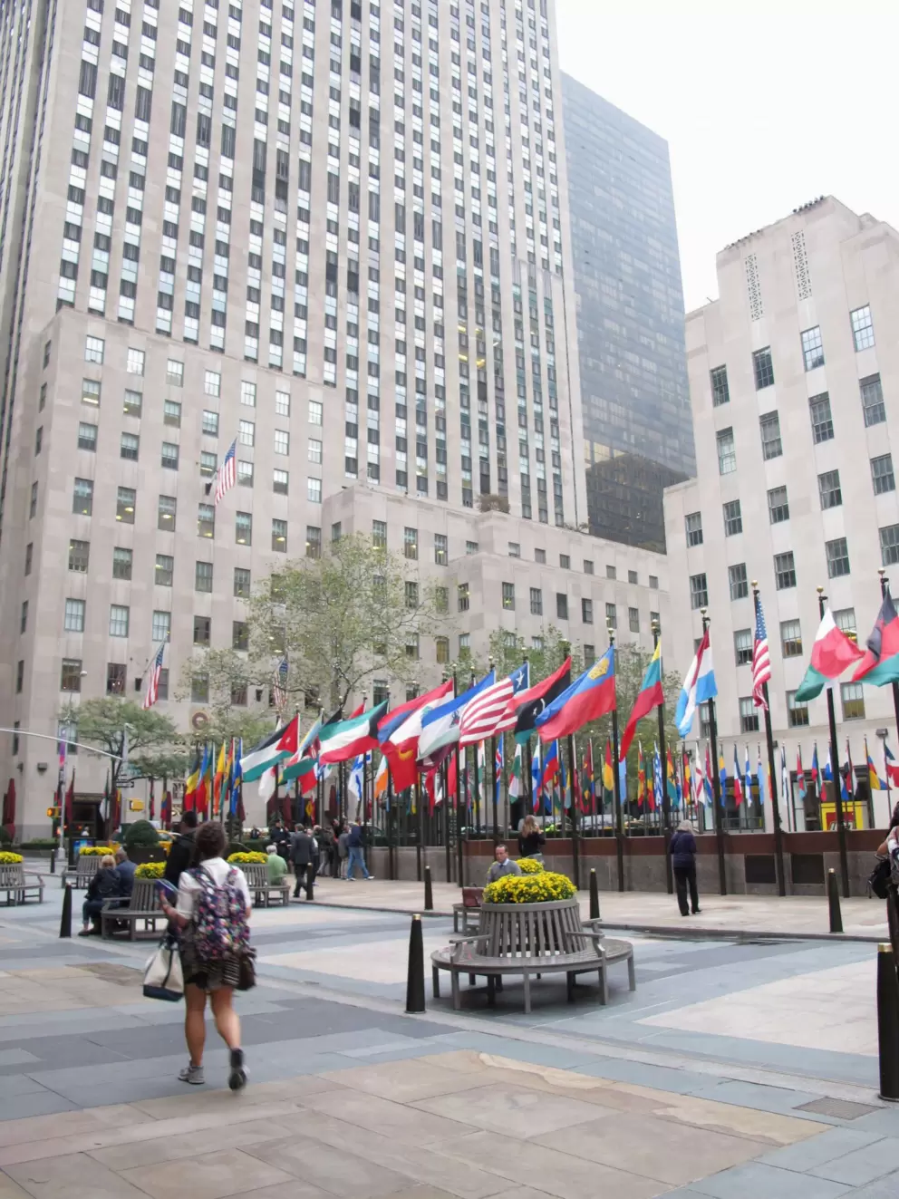 Citygoers walk outside at Rockefeller Center.
