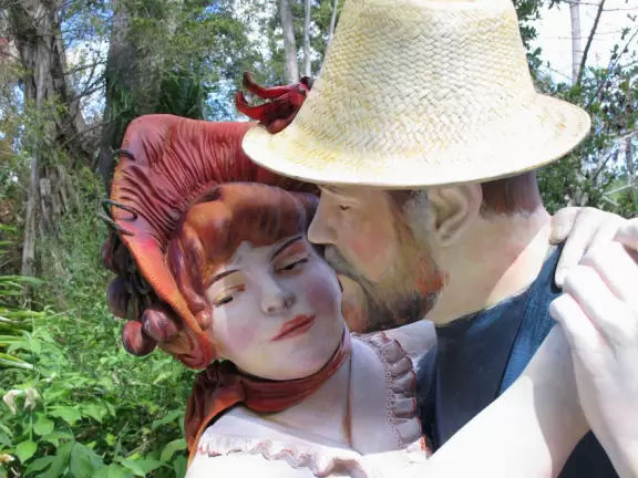 Lush paradise with water lilies galore, rustling bamboo, stone bridge, tropical flowers, strangler fig, and a gorgeous royal palm grove.