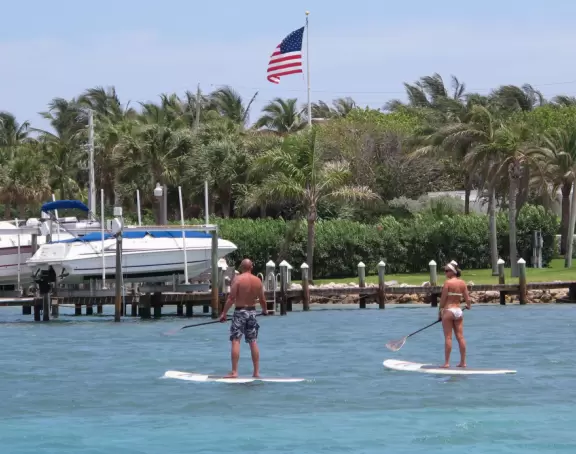 Pontoon boat tour of the mansions on Jupiter Island and the gorgeous clear waters of Jupiter Inlet.