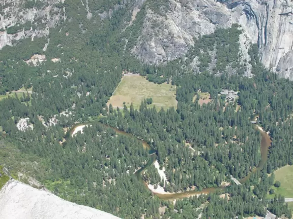 Breathtaking side-on view of half dome, three waterfalls, and the entire stunning valley.