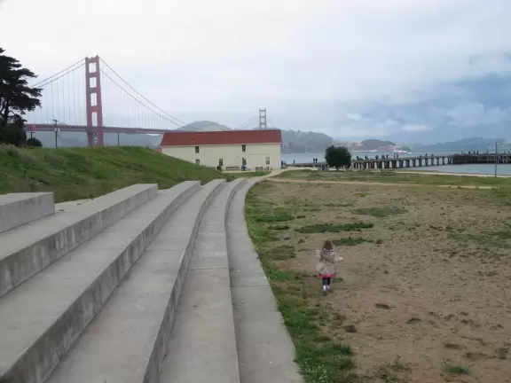 Picnic tables, amphitheater, gift/coffee shop, and wharf, under the Golden Gate Bridge!