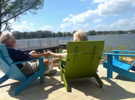 A sweet older couple sitting by the lake. He said, &quot;I'd love a backyard like this!&quot;