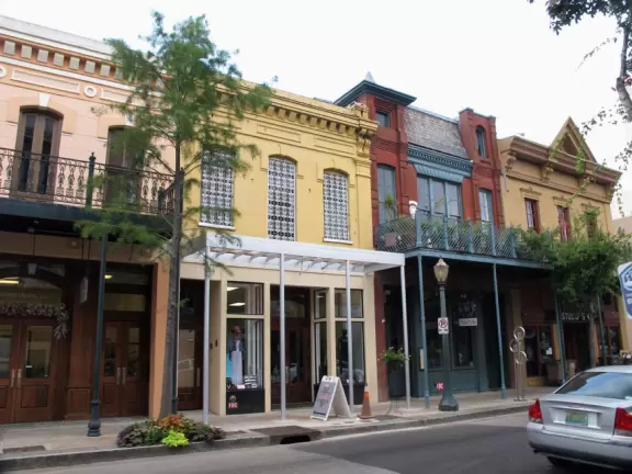 Main street in Mobile, with historic buildings with wrought-iron balconies.