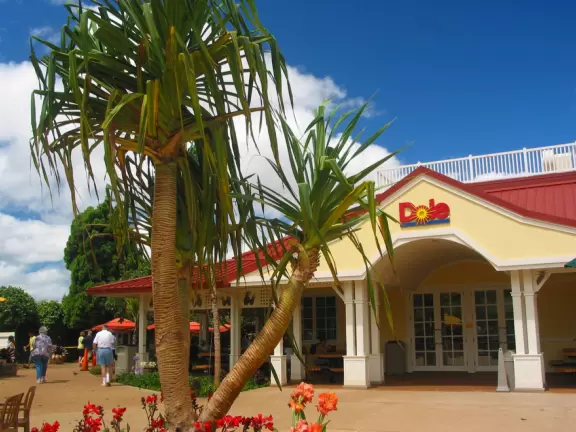 The pale yellow main building with white trim.