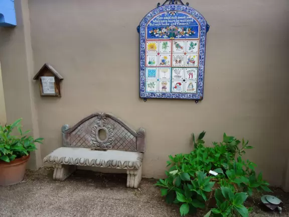 Blue tile decoration in the herb garden.