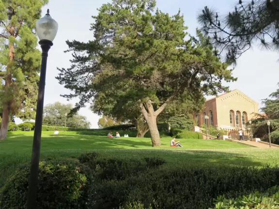 Gorgeous campus with Romanesque Revival architecture, huge sloping lawns, and old trees.