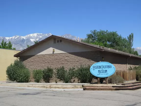 Eastern California Museum, with snowy mountains behind.